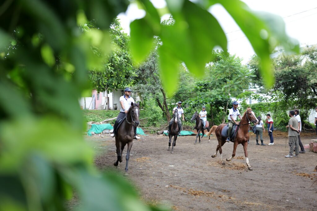 child riding horse at summer camp in Nagpur